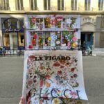 Facciata negozio Gucci con prima pagina di giornale che ne parla.